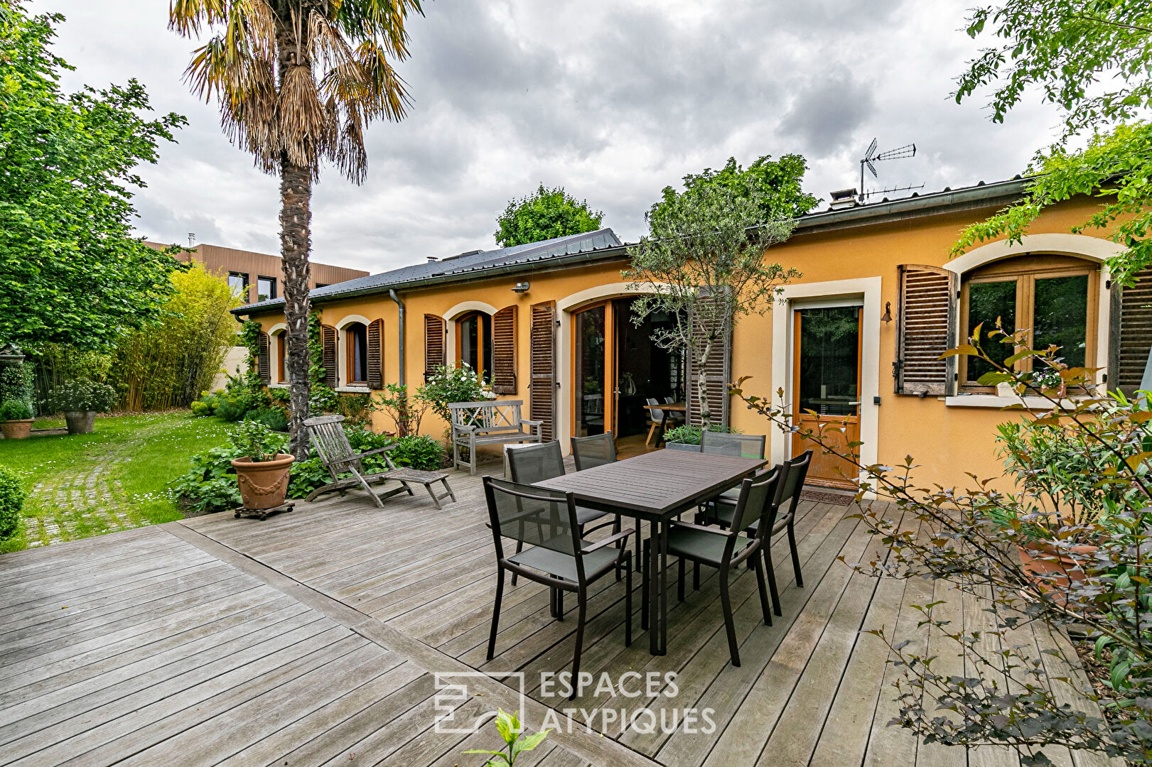 Former garage converted into a Loft with landscaped garden