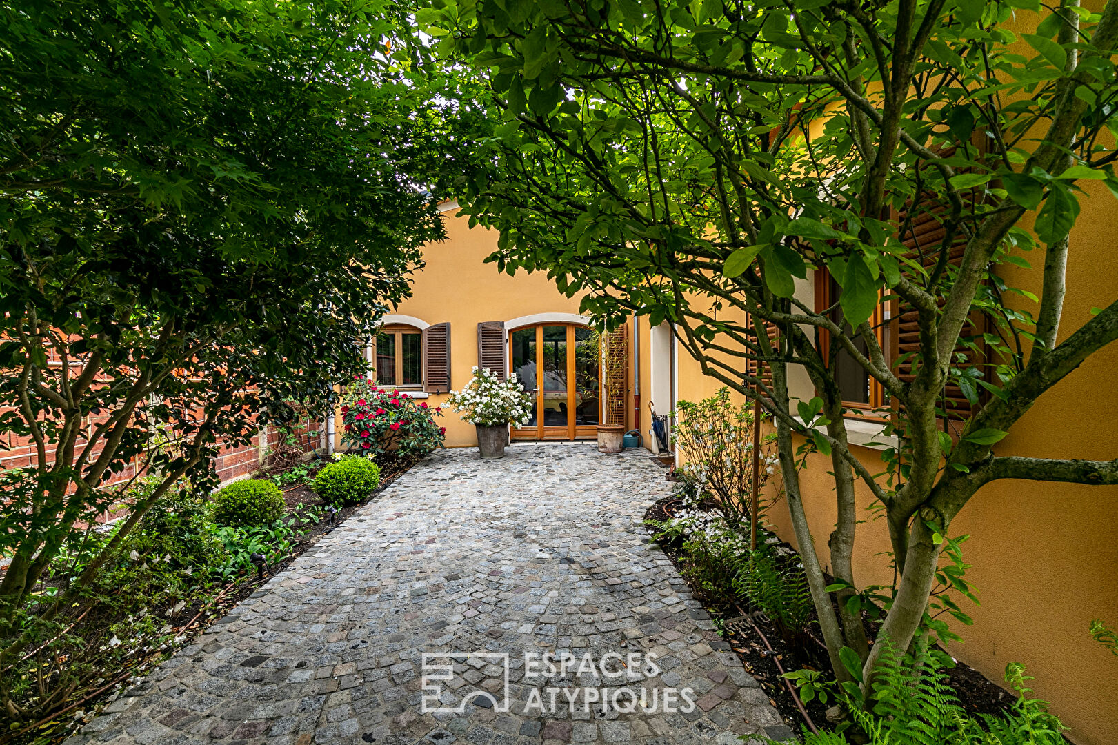 Former garage converted into a Loft with landscaped garden