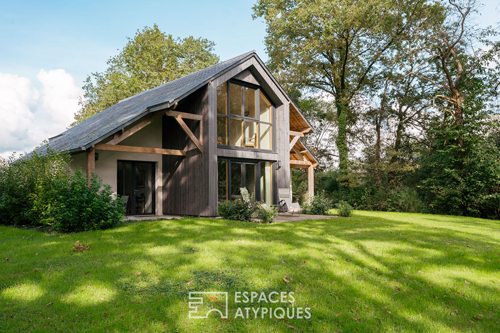 Set of two houses in its wooded park