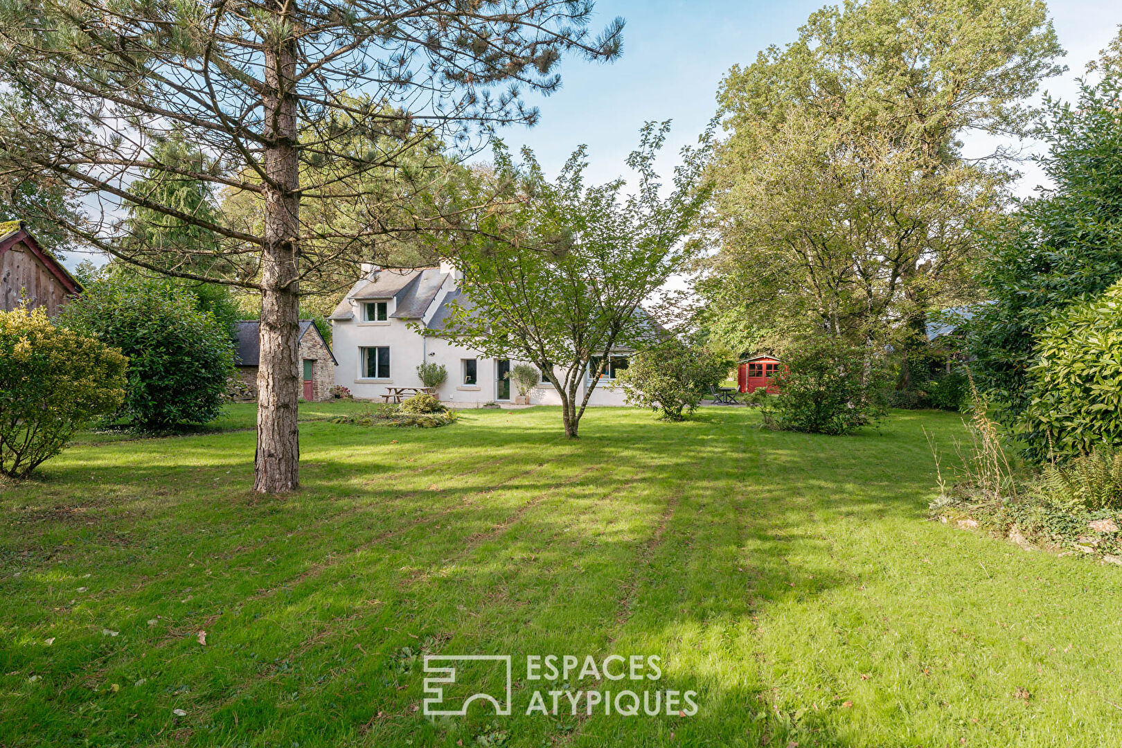 Set of two houses in its wooded park