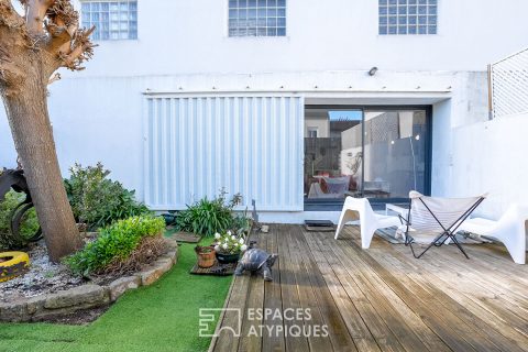 Hidden loft-style house with garden in the heart of a former workshop