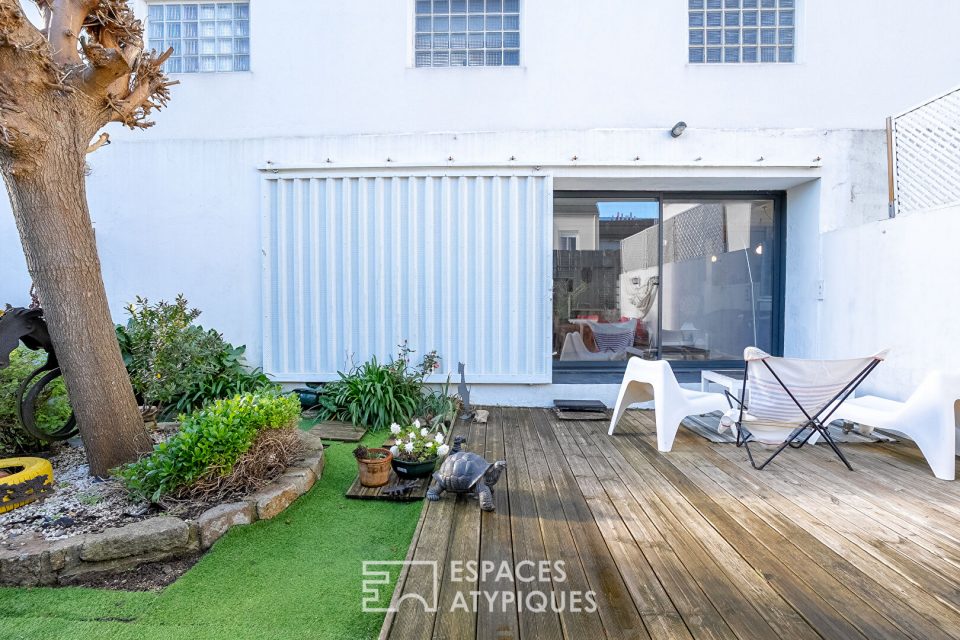 Maison-loft cachée avec jardin au coeur d'un ancien atelier