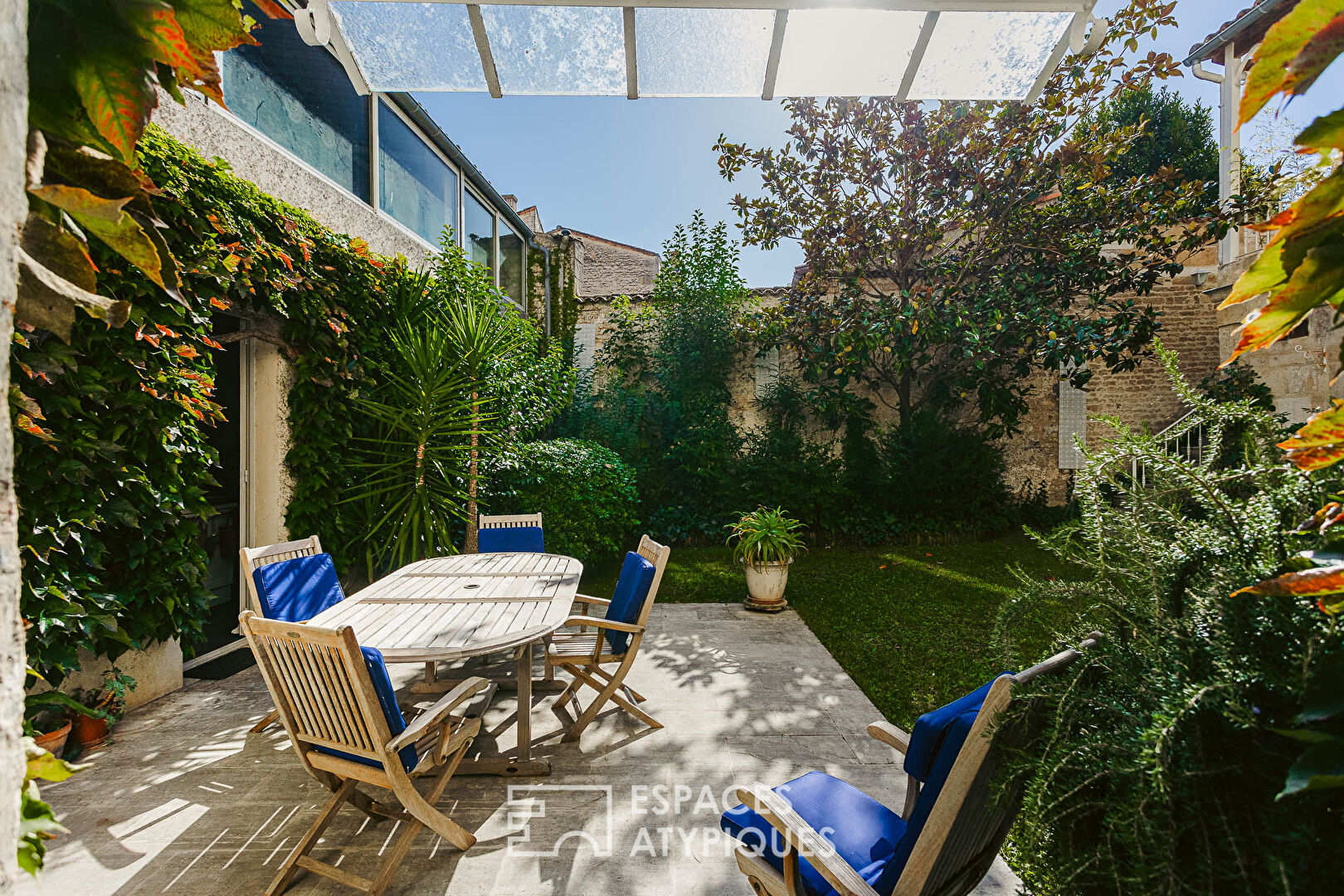 Family home around its tree-lined courtyard