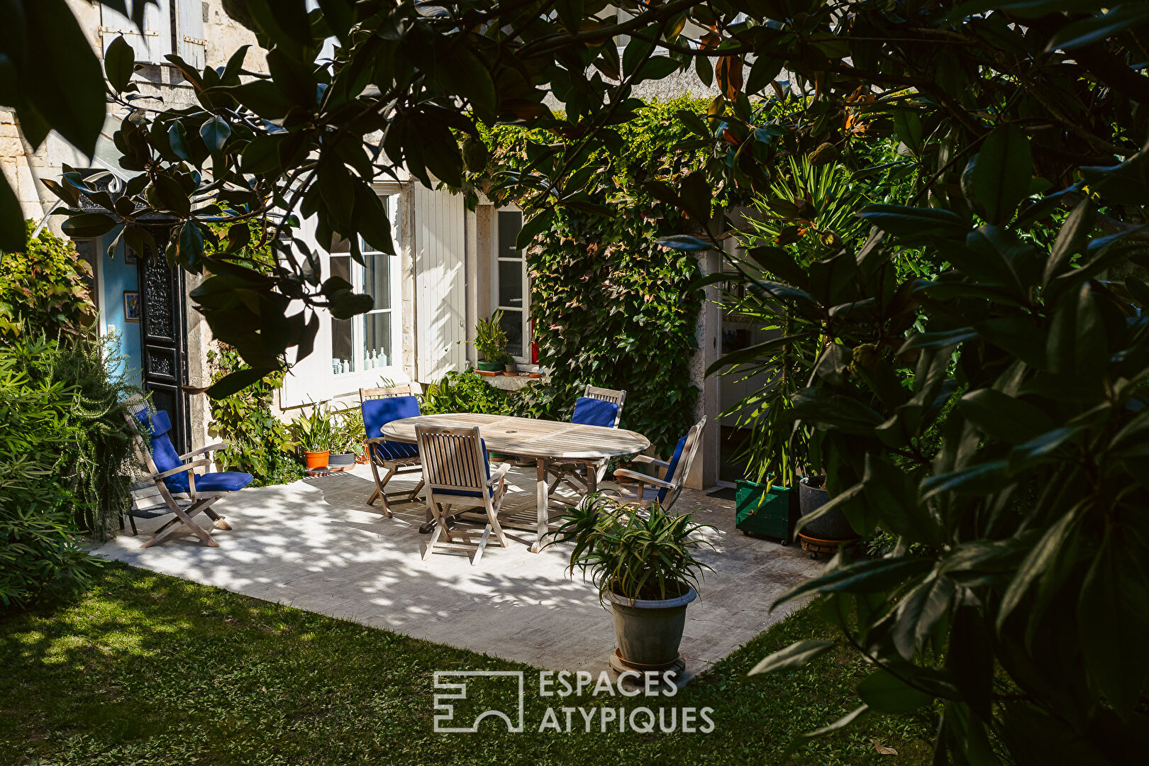 Family home around its tree-lined courtyard