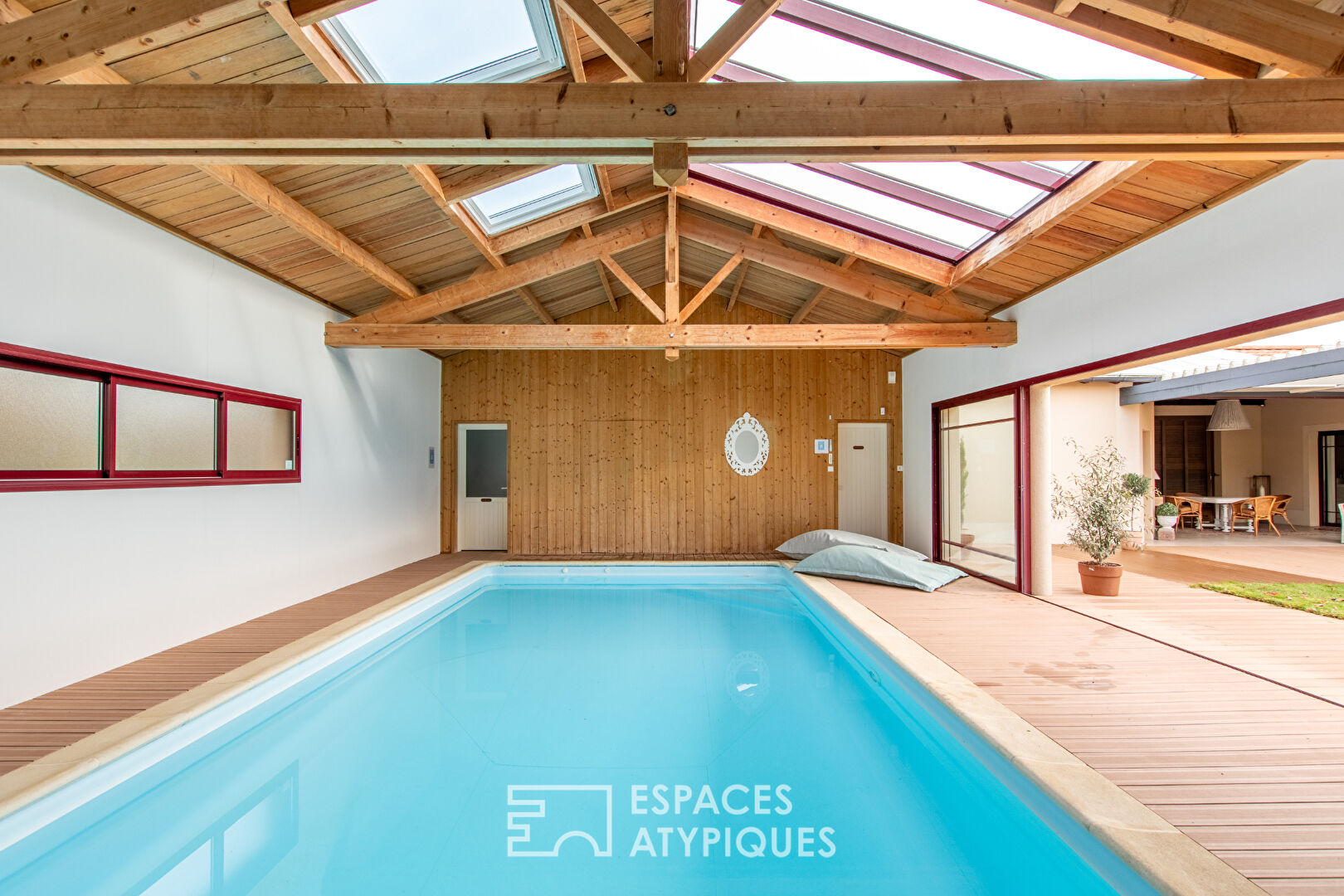 Single storey opening onto garden, terrace and indoor swimming pool