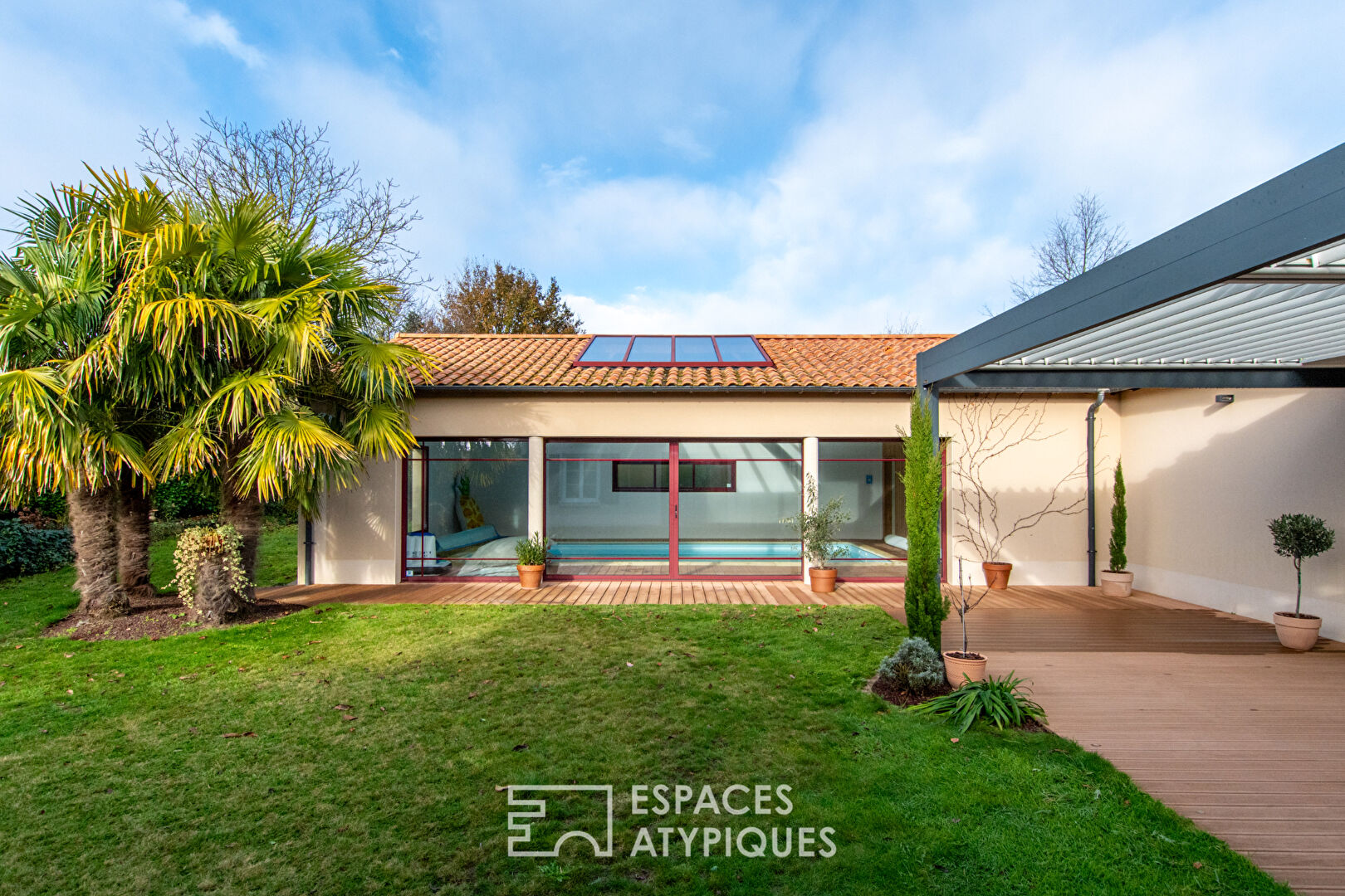 Single storey opening onto garden, terrace and indoor swimming pool