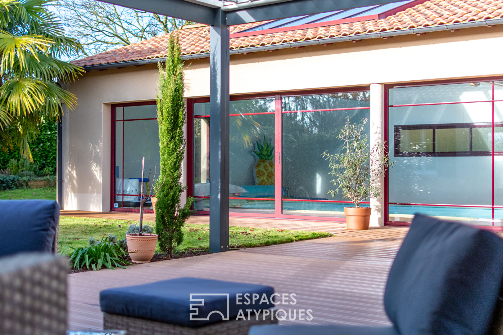 Single storey opening onto garden, terrace and indoor swimming pool