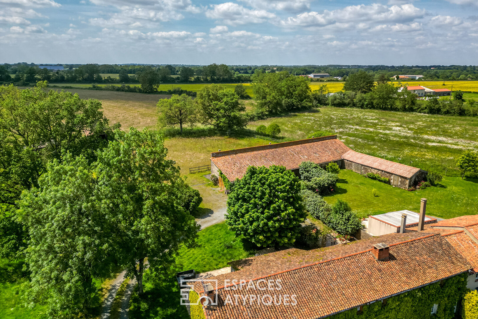 Farmhouse with rustic charm and natural setting with outbuildings