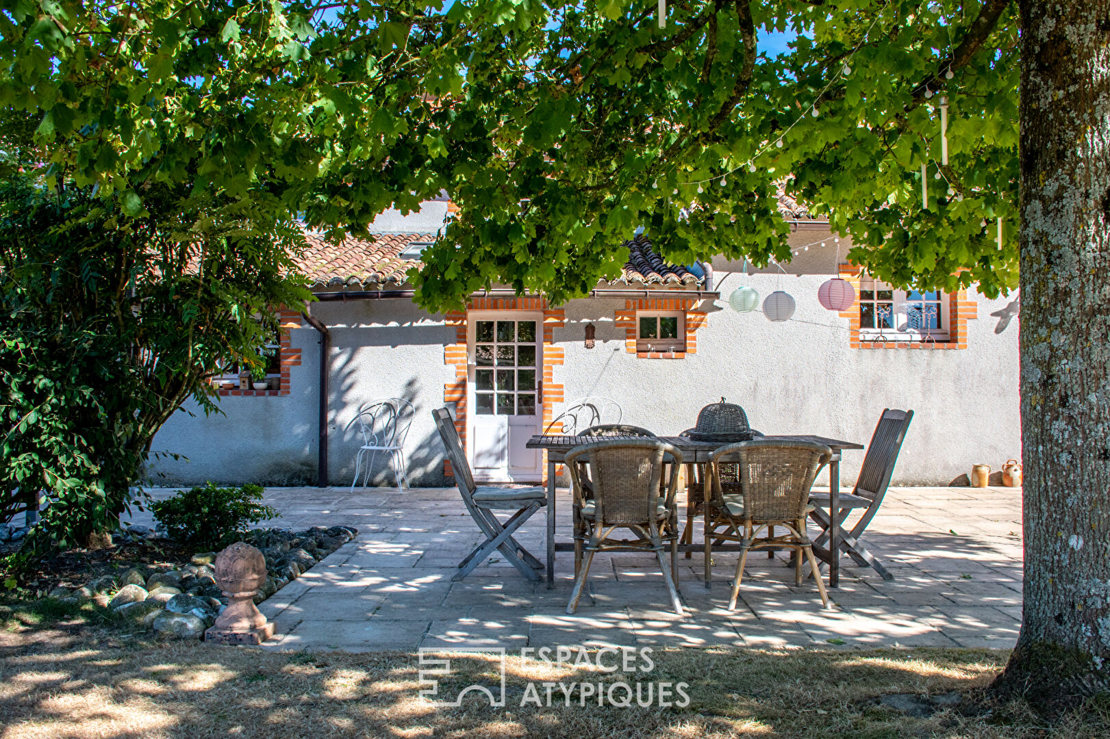 Farmhouse with rustic charm and natural setting with outbuildings
