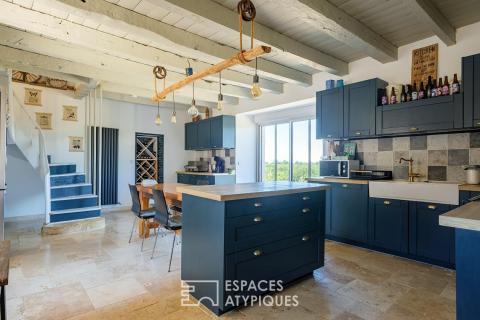 Renovated former farmhouse with outbuildings and panoramic views of the countryside