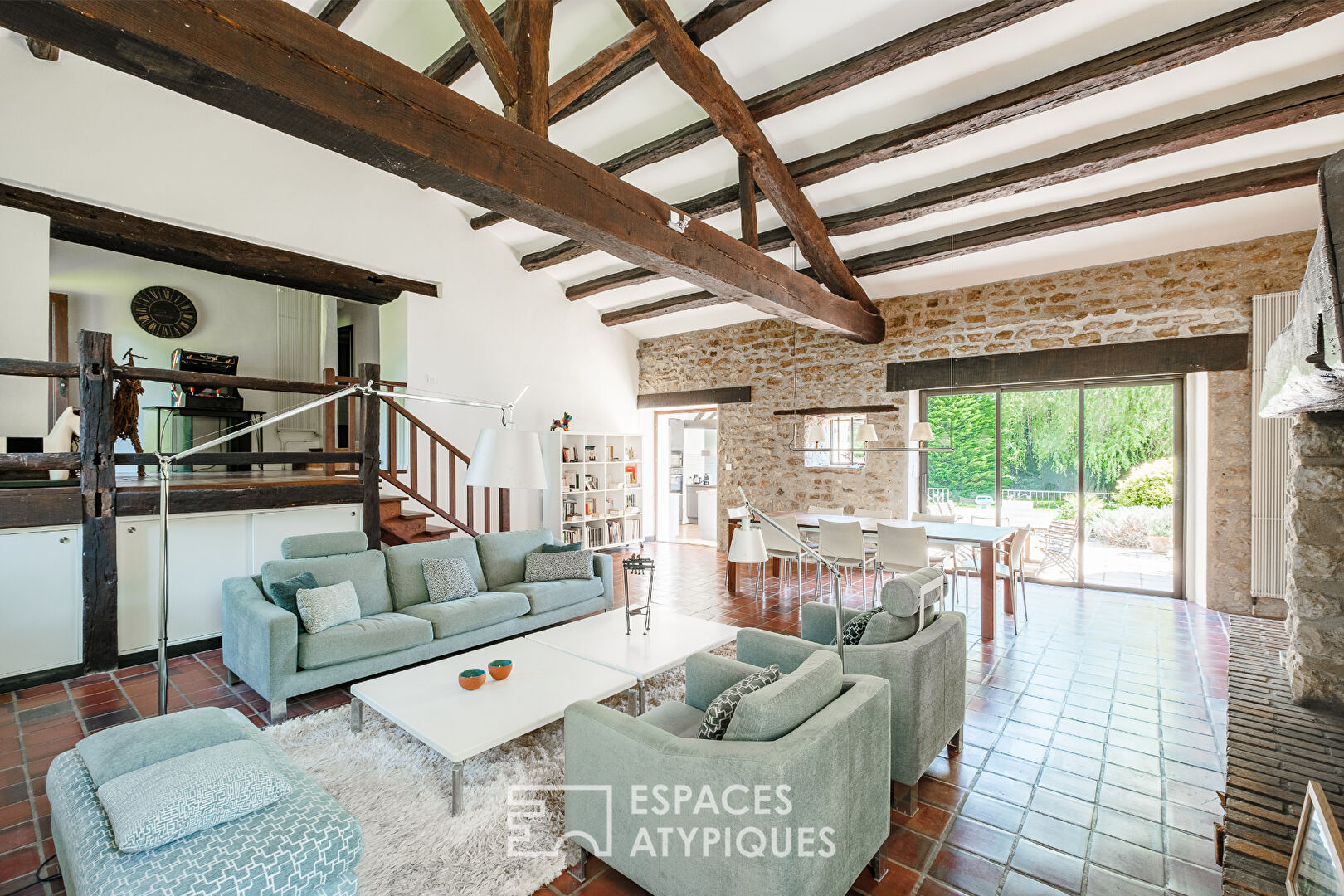Former 15th century mill reinvented with swimming pool at the foot of a castle