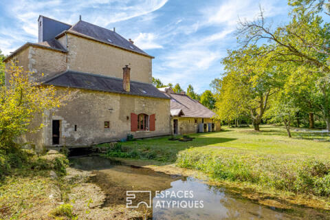 Ancien moulin de caractère dans un écrin de verdure