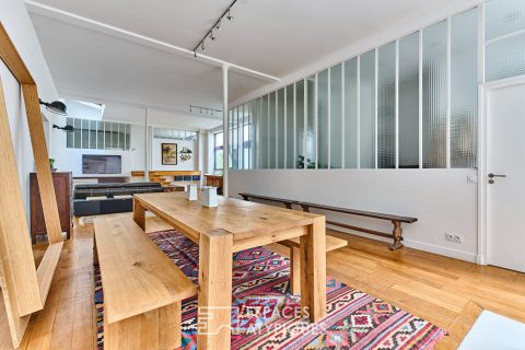 Former workshop transformed into a 150 m² loft in a quiet, green courtyard