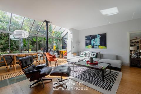 Contemporary loft with veranda and garden