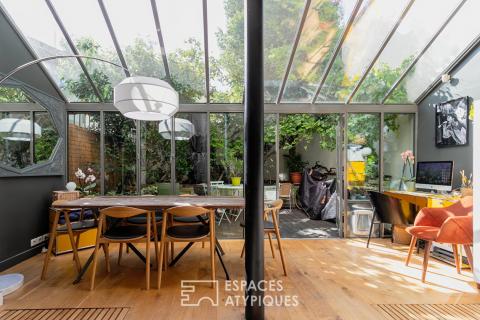 Contemporary loft with veranda and garden
