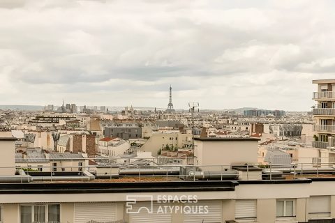 Crossing apartment with panoramic view of Paris