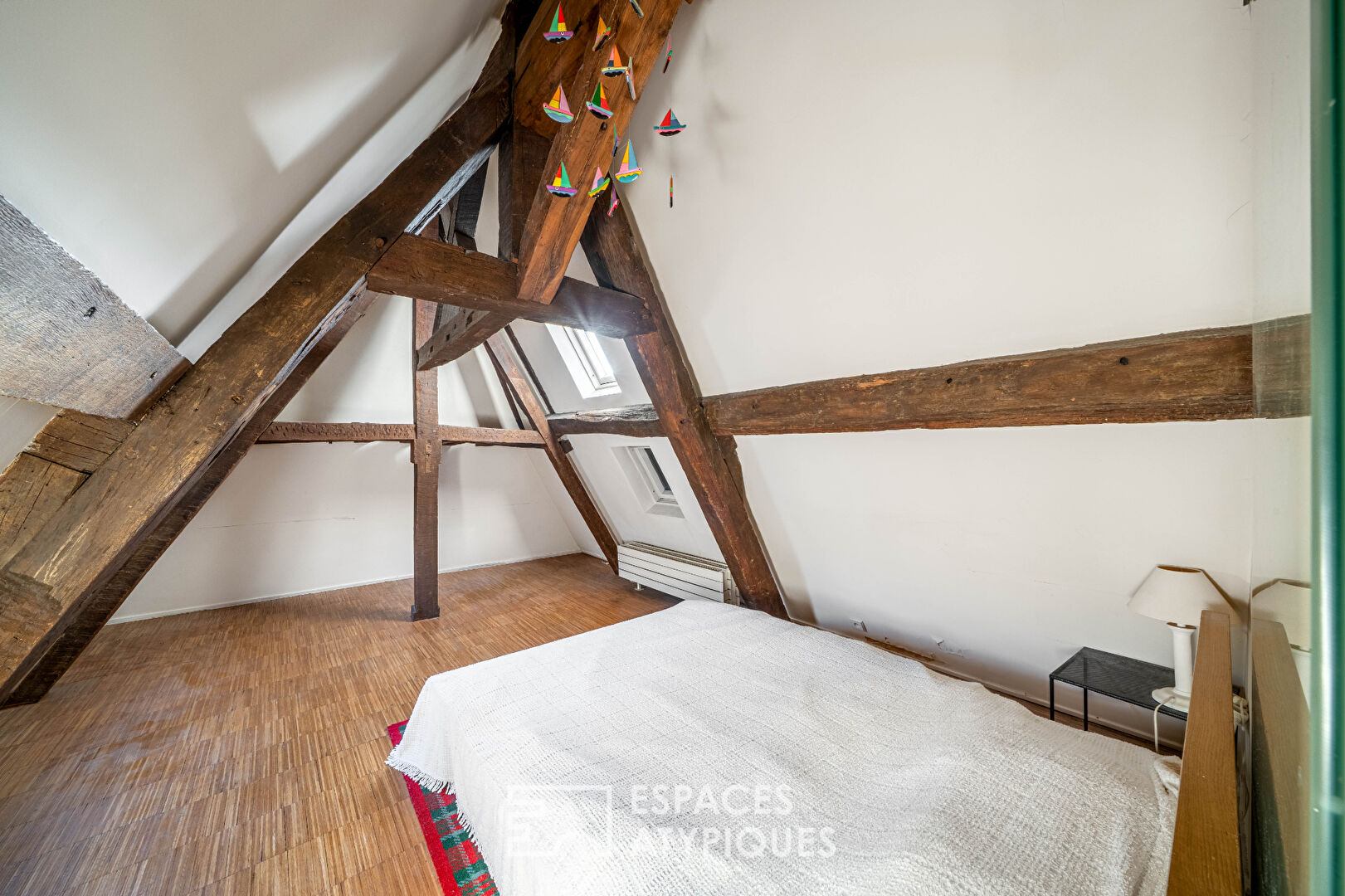 Un duplex à réinventer avec vue sur l’emblématique Place des Vosges