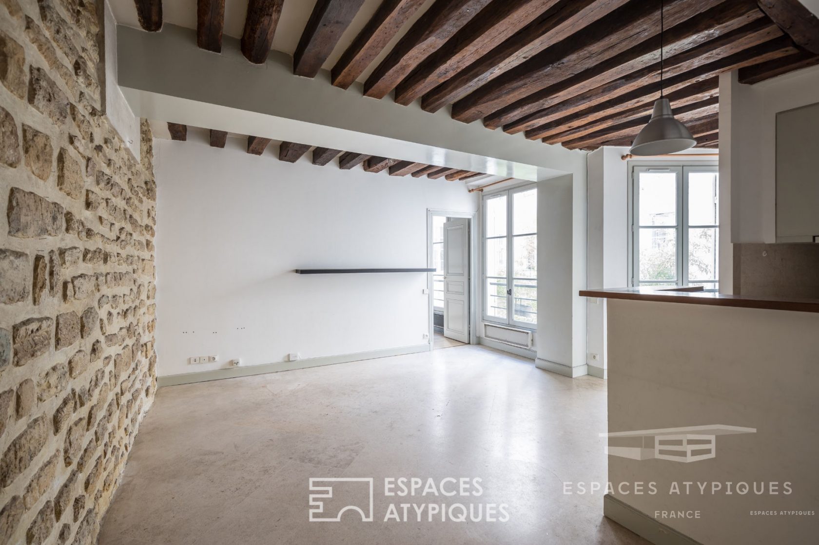 Flat with exposed stones and beams in le Marais