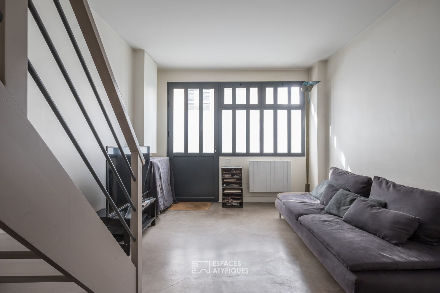Former garage converted into a triplex house