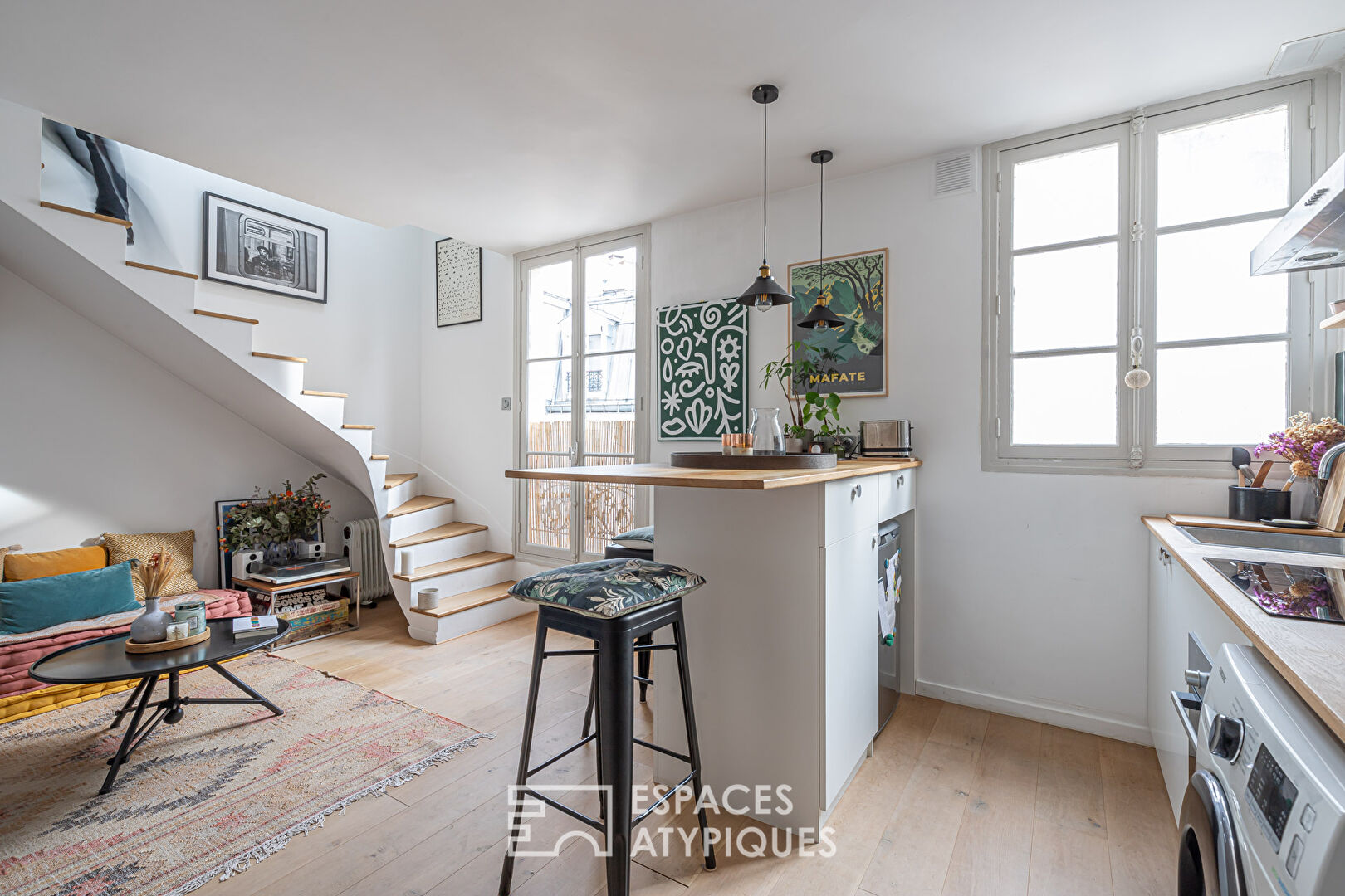 Duplex overlooking courtyard on top floor